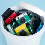 2'-'An_eco-friendly_recycling_bin_filled_with_disposable_cameras