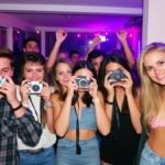 A_group_of_friends_using_disposable_cameras_at_a_party